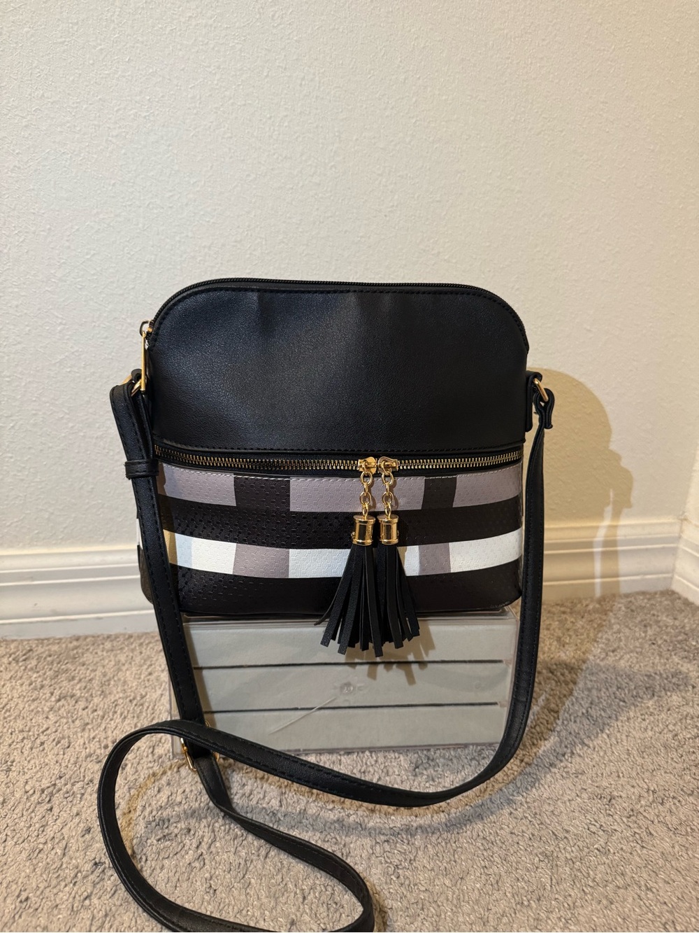 Black Crossbody Bag with Striped Accent and Tassel